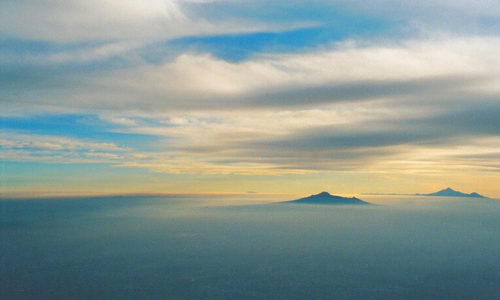 summit of Iztaccihuatl with La Malinche and Pico in the distance